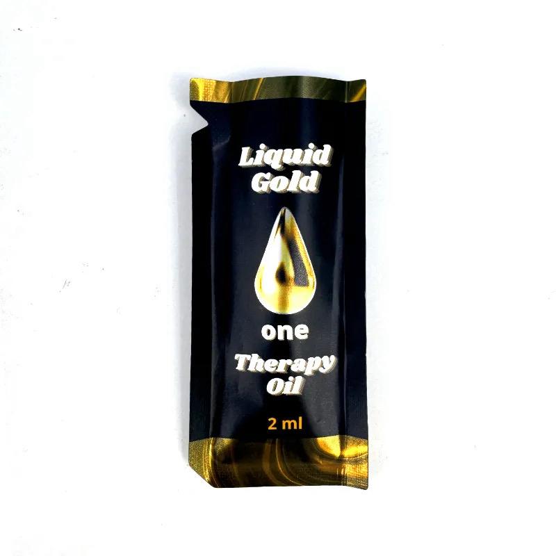 A small 2ml packet of Liquid Gold One Therapy Oil (front shot)